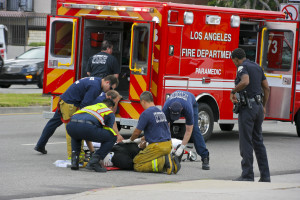 RESEDA, CALIFORNIA, USA - MAY 9: Firefighters help the victim of car accident on May 9, 2011 on Sherman Way in Reseda, California.